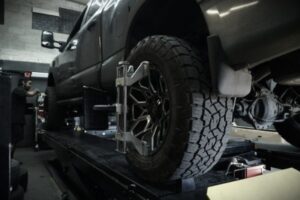 Technician performing a 4x4 alignment at American Off-Road Customs in Las Vegas